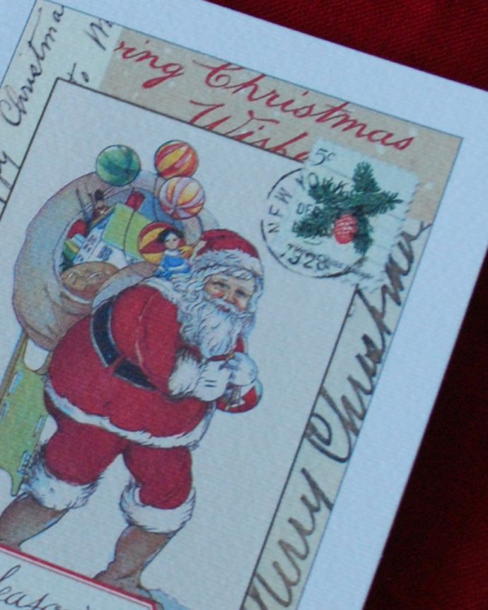 リビング雑貨　クリスマス用　カバリーニ社の封筒付きクリスマスカード（サンタクロース）。フォトフレームに入れたり、コルクボードに貼ったり…たっくさんのプレゼントを運ぶサンタクロースが可愛いデザインです。(cm-60)