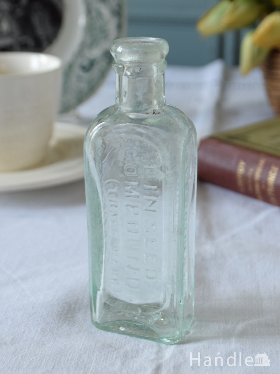 アンティークのおしゃれなガラスボトル、エンボス入りのガラス瓶（LINSEED COMPOUND） (m-5329-z)